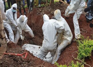 Man secretly buried at night exhumed