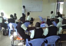 A teacher at Peter Habenga Okondo secondary School in Budalangi, Busia County talking the students through a lesson. PHOTO/Gilbert Ochieng, The Scholar Media Africa.