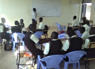 Preparations to host pioneer JSS students in Busia crystallize A teacher at Peter Habenga Okondo secondary School in Budalangi, Busia County talking the students through a lesson. PHOTO/Gilbert Ochieng, The Scholar Media Africa.