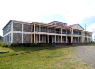 Principal raising Eldama Ravine Technical College through marketing The Administration block and part of the classes of Eldama Ravine Technical and Vocation Training College. PHOTO/Janet Kiriswo, The Scholar Media Africa.