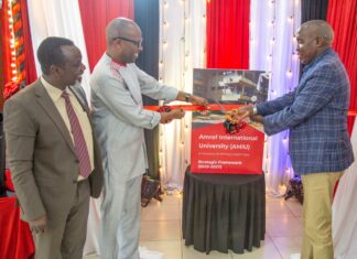 Amref University launches Five-Year Strategic Plan, boosts Africa’s Healthcare Mr. Joseph Ole Lenku (right), the Governor of Kajiado County, the hosting county to Amref International University (AMIU) and Dr. Githinji Gitahi, the Global Chief Executive Officer Amref Health Africa, the umbrella organization cutting the ribbon during the launch of the Strategic Plan 2022-2027, as Prof. Joachim Osur, the Vice Chancellor AMIU looks on. PHOTO/AMIU.