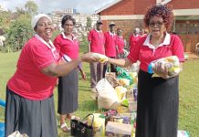 Members of the Purity International Ministries Group, an initiative helping widows and widowers in Kisii Town, receiving Christmas gifts on December 24, 2022, at the Pentecostal Evangelistic Fellowship of Africa ( PEFA) Kisii Cathedral grounds. PHOTO/Courtesy.