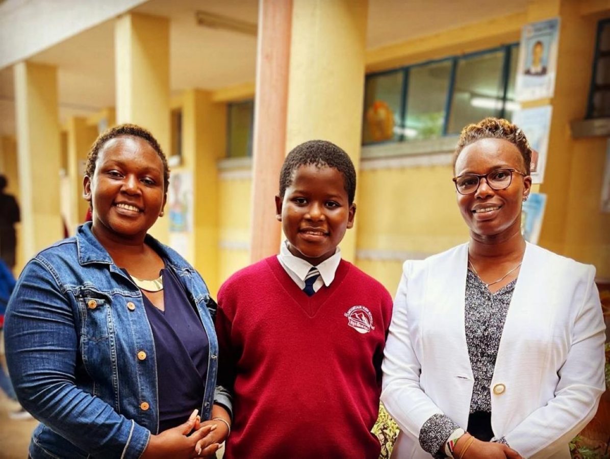 Doubar, sandwiched between his mum, Edinah Kangwana and one of his teachers, Mercy Masinde, who played a crucial role in helping him navigate through low self-esteem and instilled self-belief in him. PHOTO/Courtesy.