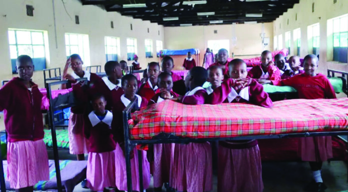 What abolishing boarding primary schools means Girls in a dormitory at Naikarra Primary School in Narok. Pupils can board at the school or attend as day-scholars. The Education Ministry, through the Basic Education PS Dr. Belio Kipsang, announced plans to abolish the boarding section in primary schools starting January next year. PHOTO/Courtesy.