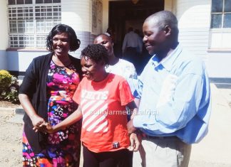 Student battling Sickle Cell Anaemia beats odds, scores A in KCSE Lavendar Awuor (center) shaking hands with Mercy Juma, principal Uasin Gishu High School, as her father, Pius Ouru, holds her in celebrating her A grade in 2022 KCSE results. PHOTO/Edmond Kipngeno, The Scholar Media Africa.