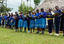 Learners from Kabirirsang primary school in Kilibwoni ward, Embwen Constituency, Nandi County, interact with the learning materials after visiting the Kabirirsang community library. PHOTO/Edmond Kipngeno, The Scholar Media Africa.