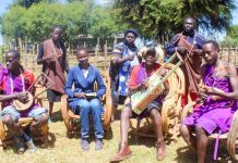 The Kesses family donning their traditional attire pose for a photo with Janet Kiriswo (second left). The family is made up of both traditional and gospel musicians with deep excellence in music. PHOTO/Janet Kiriswo, The Scholar Media Africa.
