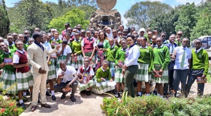 A focus on St. Andrews Tarabete Secondary, home of excellence, innovation, and self-reliance Mr. Bonface Otieno (L), Ms. Ruth Gitonga, Kabarak University staff members, and St. Andrews Tarabete Creative Writers and Book Club members after an inspiring creative writing workshop at Kabarak University last year. PHOTO/File.