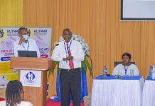 Evans Machera (center), a Nairobi-based city lawyer, addressing the First KUTRRH Annual Health Conference 2022 at the Kenyatta University Teaching, Referral & Research Hospital, two years after undergoing successful chemotherapy sessions at the health facility. PHOTO/Courtesy.