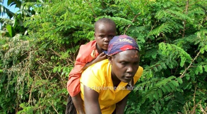 How women suffer violence for embracing modern family planning A mother carrying her daughter while attending to her duties in Kisii County. Numerous women in the Gusii region still suffer GBV after resolving to embrace modern family planning and reproductive health decisions. PHOTO/Ben Oroko, The Scholar Media Africa.