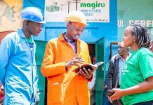 John Magiro (center), the founder and CEO of Magiro Power, chatting with staff. PHOTO/Courtesy.