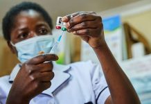 A doctor drawing the malaria vaccine from a vial. The RTS,S malaria vaccine is being expanded to more sub-counties in Kenya, and also in Uganda and Ghana. PHOTO/Courtesy.