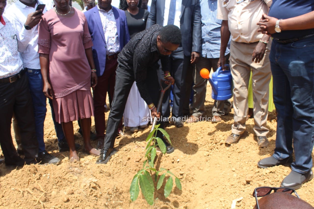Youth Affairs, Sports and Arts Cabinet Secretary Ababu Namwamba plants a tree during the event. PHOTO/Gilbert Ochieng, Scholar Media Africa.
