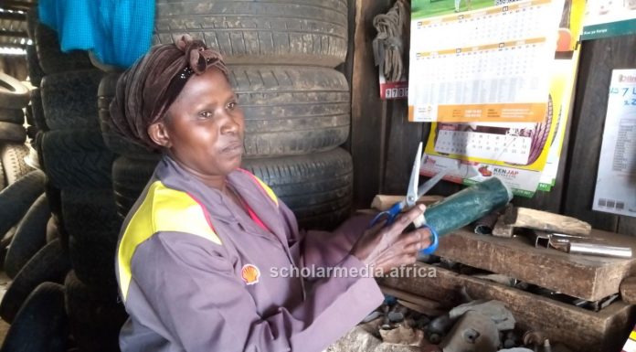 Breaking Barriers: Nzisa’s journey to becoming a mechanic Margaret Nzisa, who works at her brother's garage. PHOTO/Janet Kiriswo, Scholar Media Africa.