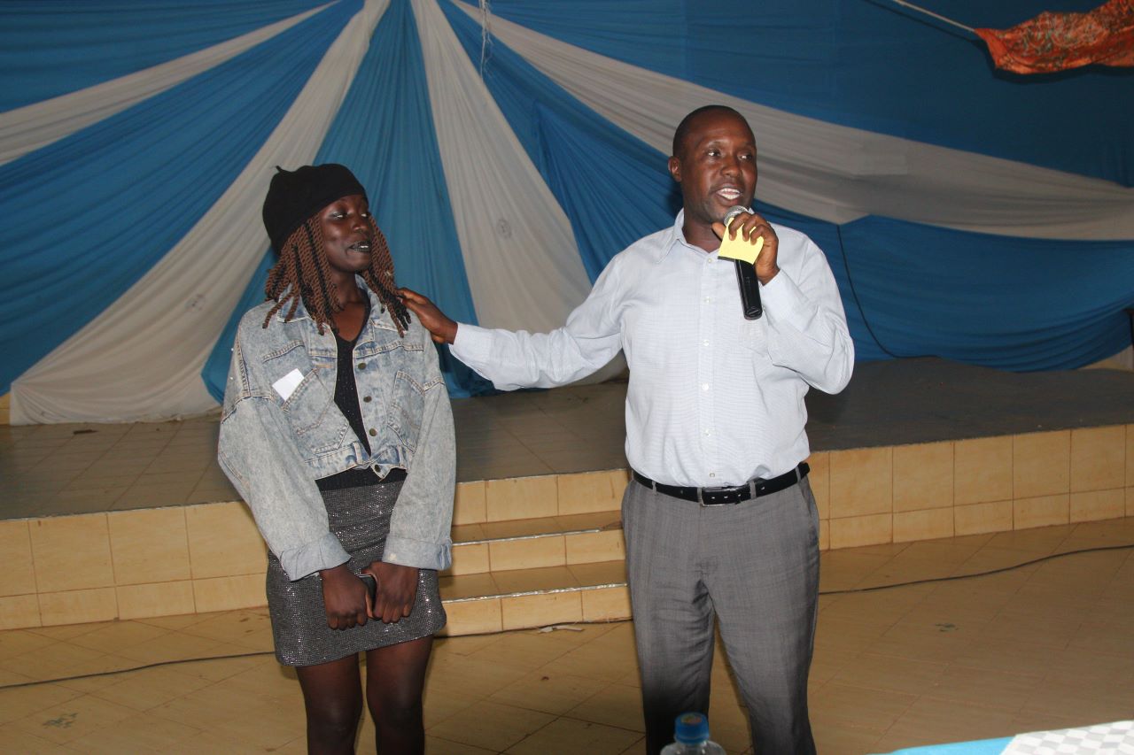 Dr. Areba acknowledging work well done by one of the performers. PHOTO/Boaz Khuteka, KSU Media.