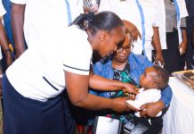 A healthcare worker administer the malaria vaccine to a child during the launch of the accelerated use of the vaccine in Vihiga county. PHOTO/Ministry of Health.