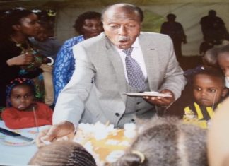 Prof. Ngugi: Rethinking CBC, academic philanthropy and stakeholder reinvention Professor David Ngugi, shares a piece of cake with his grandchildren on his 80th Birthday celebration. PHOTO/Courtesy.