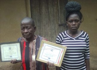 How Kundu, a traditional birth attendant, aids expectant mothers deliver Agnes Kundu, a Traditional Birth Attendant (TBA), showcasing her certificates. Alongside her is one of her clients. PHOTO/Gilbert Ochieng, Scholar Media Africa.