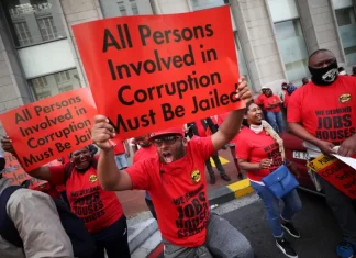 The Butterfly Effect: Understanding corruption in Africa October 7, 2020. Congress of South African Trade Unions (COSATU) members carry placards during a nationwide strike concerning corruption-related issues, and job losses in Cape Town, South Africa. PHOTO/Mike Hutchings Via Reuters.