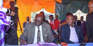 Baringo-based hospital to reap big for rescuing President Salva Kiir Barnabas Benjamin, Minister for Presidential Affairs of the Republic of South Sudan, signing the visitors book after leading a delegation to visit the health facility for rescuing President Salva Kiir's life three decades ago. Beside him is Felix Kimwok Baringo County Deputy Governor. PHOTO/Mercy Mission Hospital (MMH).