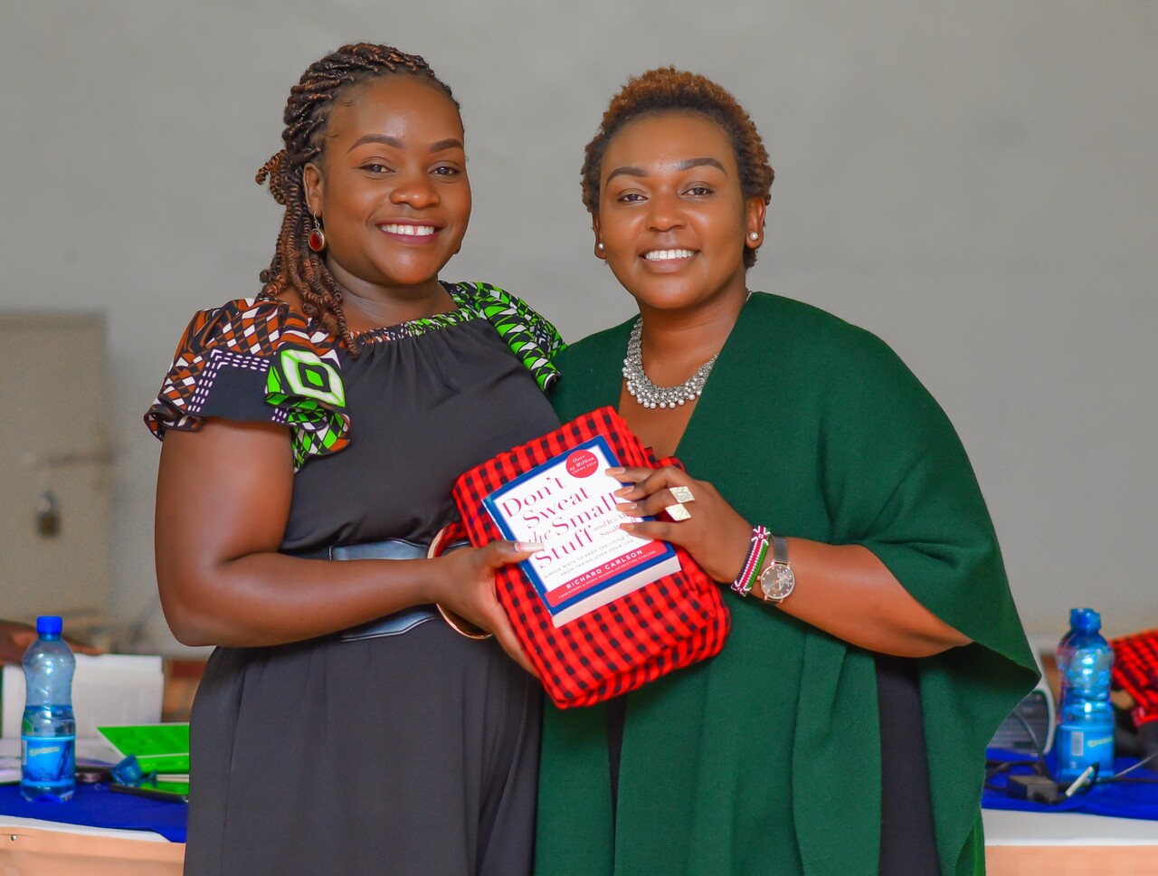 Dr. Orina receiving her gifts from Ms. Kangwana  during the certification session. PHOTO/Arise Circle. 