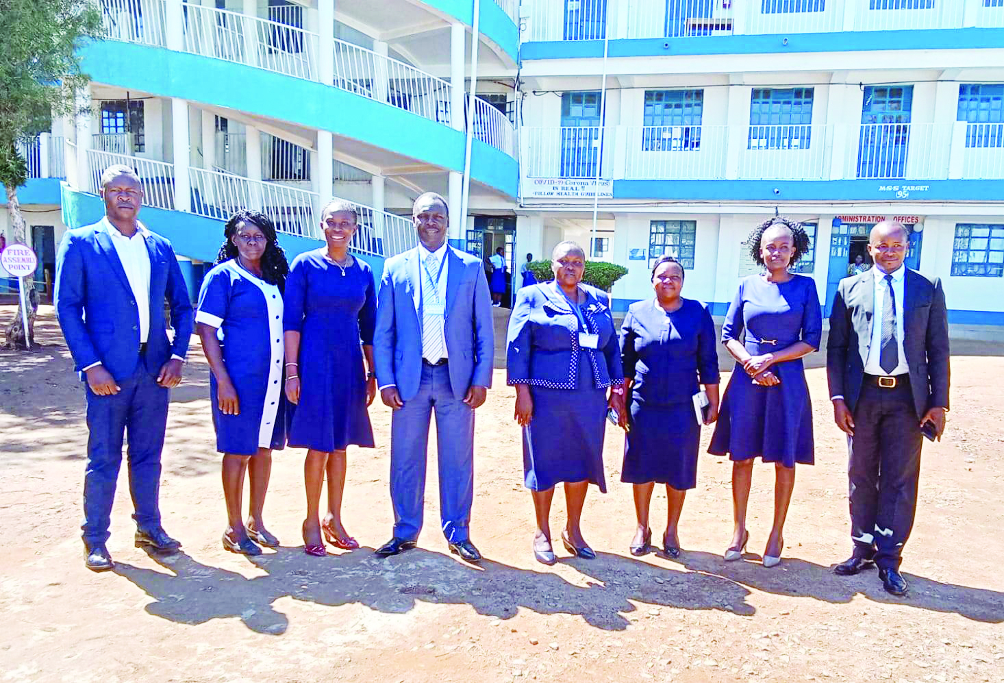 BoM Chair, Dr. Charles Nyandusi (center), Principal Nyanumba (fourth right) and other staff members during a prize-giving day in 2022. photo/Tombe Girls. 