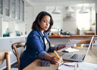 Decoding Africa’s future of remote work and gig economy Young woman taking notes while going through paperwork in her remote-work schedule. Africa's future of work is taking shape towards innovation, remote jobs and tech-backed approaches. PHOTO/techcabal.