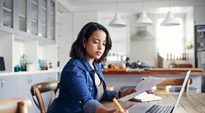 Decoding Africa’s future of remote work and gig economy Young woman taking notes while going through paperwork in her remote-work schedule. Africa's future of work is taking shape towards innovation, remote jobs and tech-backed approaches. PHOTO/techcabal.