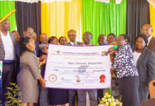 Nyeri National Polytechnic Chief Principal David Mwangi, Esther Mworia, PS TVETS, representatives from KNQA and other invited guests pose for a photo with the Certificate of Accreditation awarded to the polytechnic during the launch of CBS Curriculum on May 12, 2023. PHOTO/Courtesy.