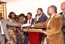 Theologian and gospel musician Reuben Kigame launches new book Evangelists and other Christian leaders join hands in a book dedication prayer during the launch of Essays in African Theology and Christianity, authored by Reuben Kigame. PHOTO/Courtesy.