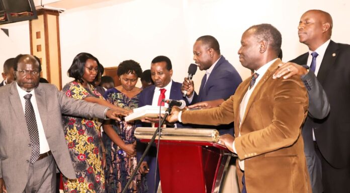 Theologian and gospel musician Reuben Kigame launches new book Evangelists and other Christian leaders join hands in a book dedication prayer during the launch of Essays in African Theology and Christianity, authored by Reuben Kigame. PHOTO/Courtesy.