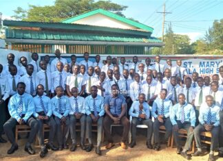 George Onyango, newly-crowned Chief Principal steering St. Mary’s Ukwala Student Council body of St. Mary's Ukwala High School pose for a photo at the main gate. Photo/Bonface Otieno, Scholar Media Africa.