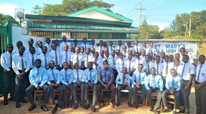 George Onyango, newly-crowned Chief Principal steering St. Mary’s Ukwala Student Council body of St. Mary's Ukwala High School pose for a photo at the main gate. Photo/Bonface Otieno, Scholar Media Africa.