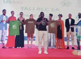 Ogwal: Learn sign language and embrace the hearing impaired Alex Ogwal (center) presenting a poem in sign language in Nairobi to create awareness about uniqueness of sign language. He has been championing the need for sign language spaces where the wider communities come together to have discourse in sign language. PHOTO/Courtesy.