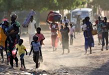 Exploring pathways to globalized security and peacebuilding People flee their homes in areas around Khartoum, Sudan, recently, as fights intensified. PHOTO/AFP.