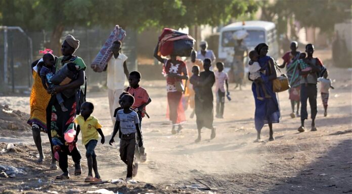 Exploring pathways to globalized security and peacebuilding People flee their homes in areas around Khartoum, Sudan, recently, as fights intensified. PHOTO/AFP.