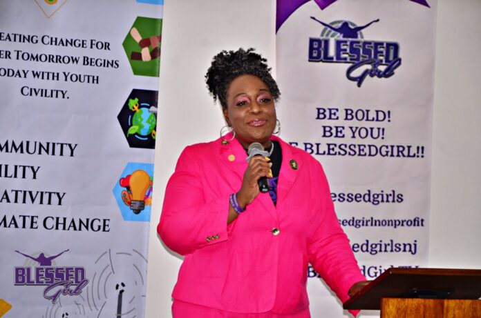 Dr. Anana Phifer-Derilhomme, Founder of BlessedGirl Global and a World Civility Ambassador, addresses participants during a BlessedGirl conference in Nairobi on July 15, 2023, before embarking on a tour to different schools and places donating sanitary pads and panties. PHOTO/BlessedGirl.