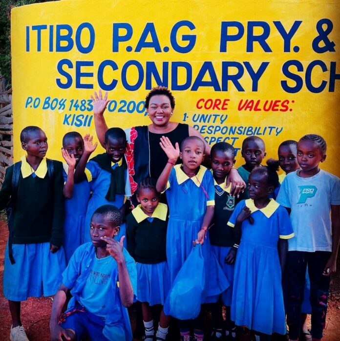 Edinah Kangwana MBS, MHC., having a light moment with pupils at Itibo P.A.G Primary and Junior Secondary School recently. As a mental health and wellness champion, she has been on a mission to empower young people on matters mental health, personal development and related matters of interest. PHOTO/Courtesy.