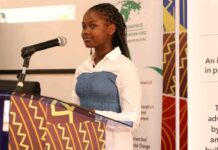 Lyn Denisse, addressing the audience at the KIPPRA workshop. She asked the government to restructure operations at the ministry to enhance inclusion of children. PHOTO/Lyn Denisse.