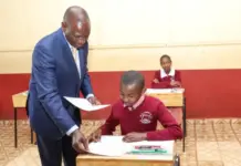 October 30, 2023, at Kikuyu Township Primary School, Kiambu County. President William Ruto issuing exam papers to candidates during the official start of the KCPE and KPSEA National Examinations. The KCPE exams and the 8-4-4 system have come to an end, with KPSEA taking over with earnest. PHOTO/X (@WilliamsRuto)
