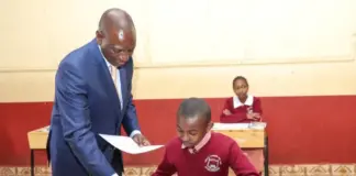 Of National Examinations: The end of an era October 30, 2023, at Kikuyu Township Primary School, Kiambu County. President William Ruto issuing exam papers to candidates during the official start of the KCPE and KPSEA National Examinations. The KCPE exams and the 8-4-4 system have come to an end, with KPSEA taking over with earnest. PHOTO/X (@WilliamsRuto)
