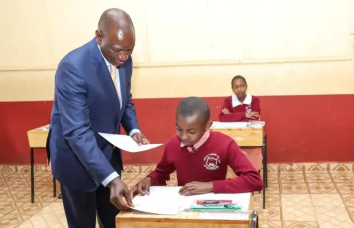 October 30, 2023, at Kikuyu Township Primary School, Kiambu County. President William Ruto issuing exam papers to candidates during the official start of the KCPE and KPSEA National Examinations. The KCPE exams and the 8-4-4 system have come to an end, with KPSEA taking over with earnest. PHOTO/X (@WilliamsRuto)