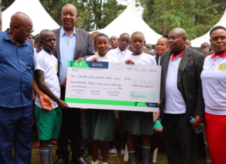 Nyamira Governor flags off beneficiaries of his sponsorship program Nyamira Governor Amos Nyaribo (second left) and CECM Education (far right) Emily Ongaga, and other county officials present a dummy cheque to the county education beneficiaries during the flagging off of the governor's sponsorship fund in Nyamira County on January 15, 2023. PHOTO/Dan Nyamanga, Scholar Media Africa.