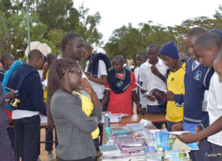 Toroitich Yegon’s relentless pursuit of success Patrick Yegon (next to the lady in specs) engaging with students in his mentorship and book tour at GG Rumuruti Boys High School. PHOTO/Janet Kiriswo, Scholar Media Africa.